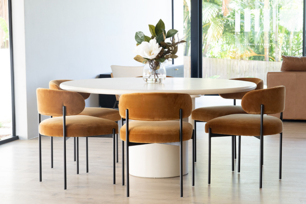 Fontaine Dining Chair with half-moon curved back and metal legs, upholstered in performance amber velvet, modern Art Deco inspired dining chair for elegant interiors. Modern elegant dining.