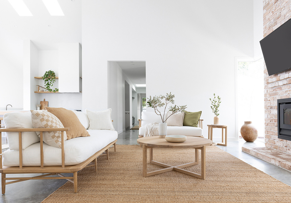 Overhead diagram comparing three living room rug layout options, including all furniture on the rug, front sofa legs on the rug, and coffee table on the rug for different living room sizes.