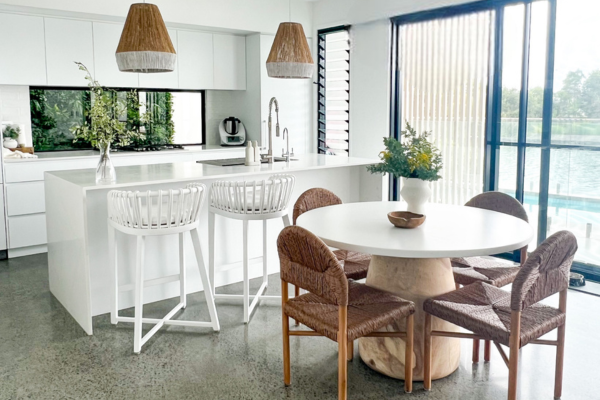 Luxury coastal home styled with soft neutral tones and refined decorative accents.