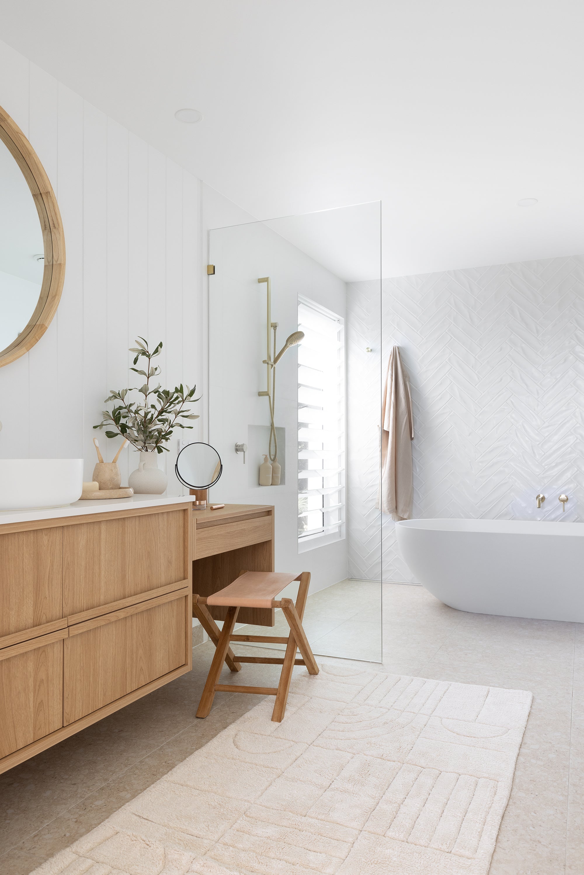 Natural cotton bath runner in modern coastal bathroom interior with light timber vanity and layered neutral styling