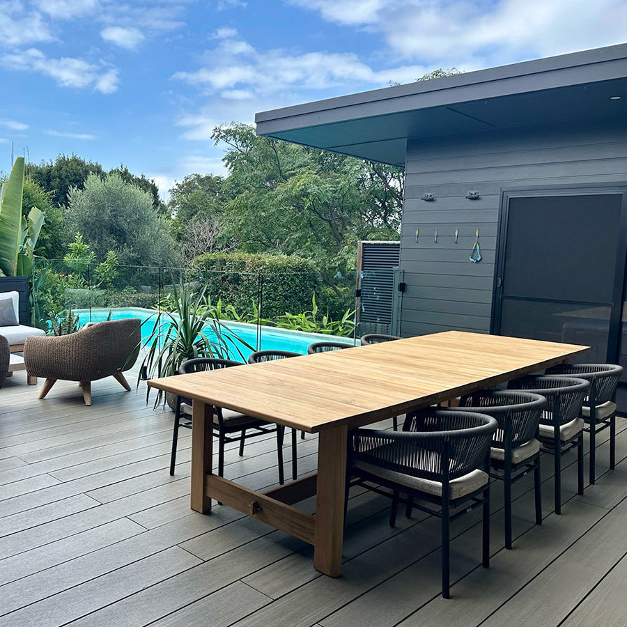 Amalfi outdoor dining table in A-grade teak styled in a modern coastal outdoor setting