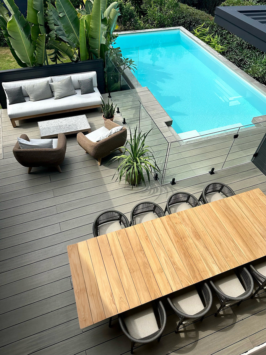 Amalfi outdoor dining table in A-grade teak styled in a modern coastal outdoor space