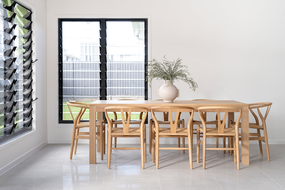Austin Dining Table crafted from solid American Oak with a finely sanded surface and natural raw finish, built for durability and timeless style. Styled in this modern home.