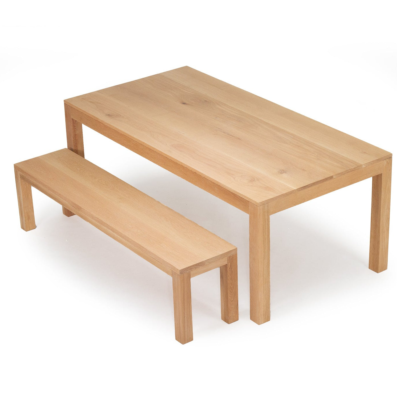 Austin solid oak dining table with matching bench angled view
