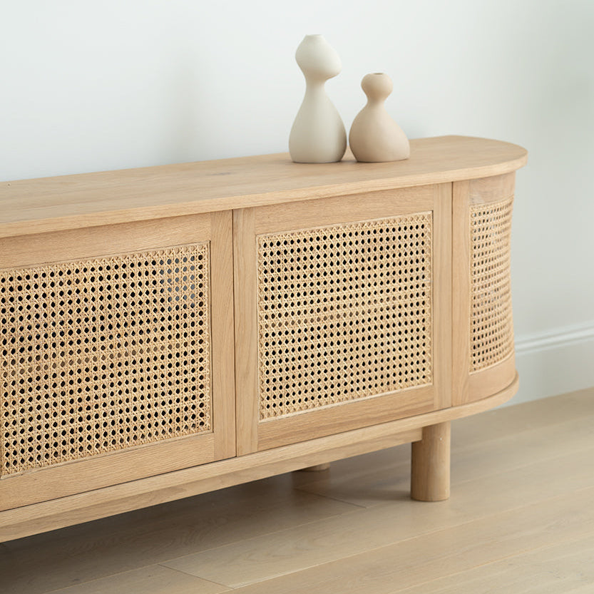 Solid oak entertainment unit with curved ends styled in modern coastal living room