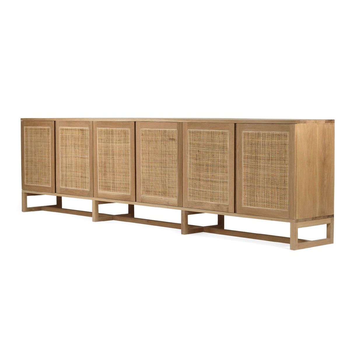 Beach House 300cm natural oak and rattan sideboard, angled front view showing the natural oak tabletop and rattan doors