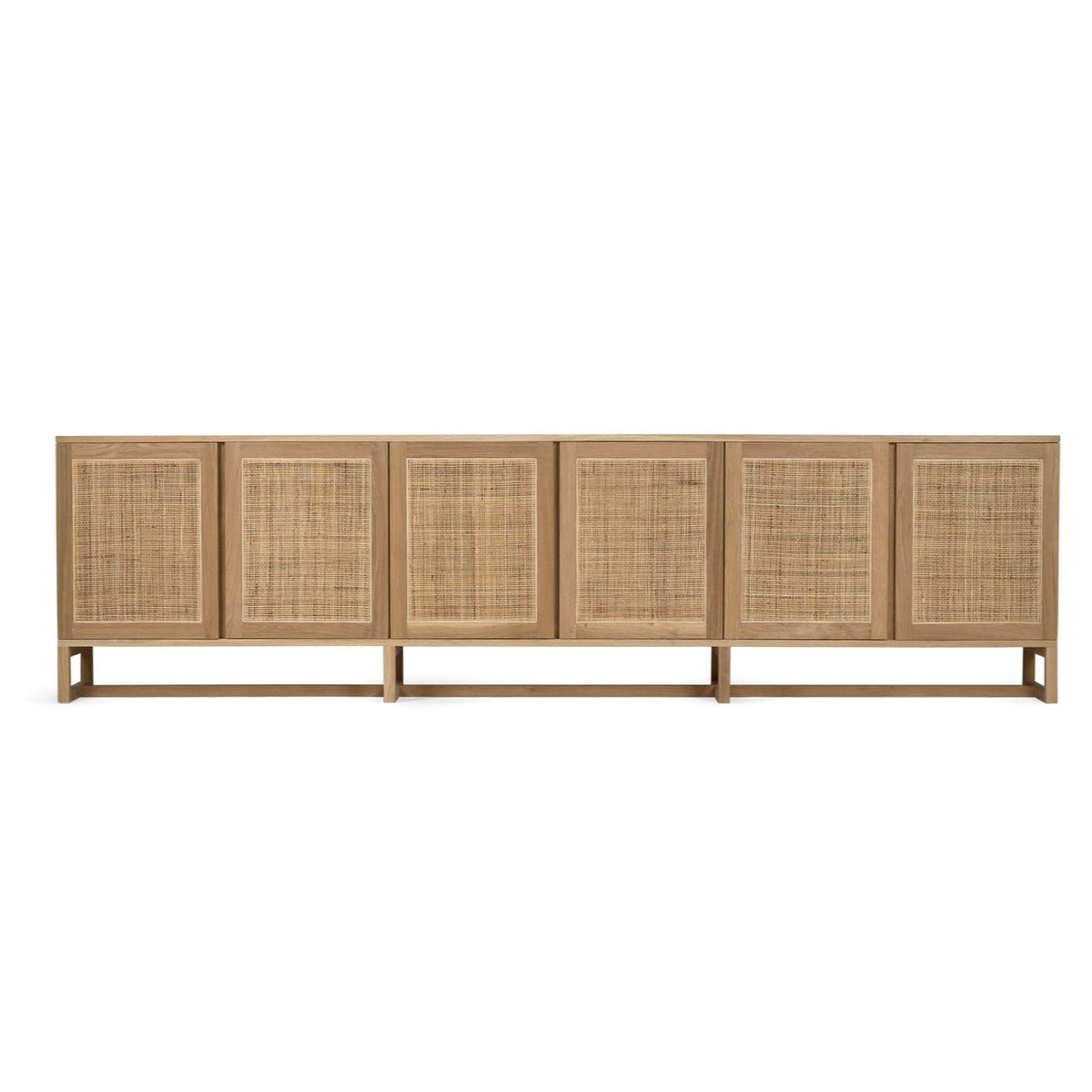 Beach House 300cm natural oak and rattan sideboard, front hero view showing six rectangular rattan doors and a raised timber base