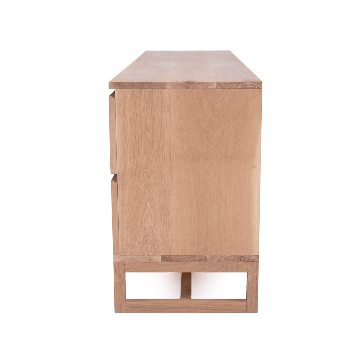 Side view of the Beach House six-drawer chest in natural oak