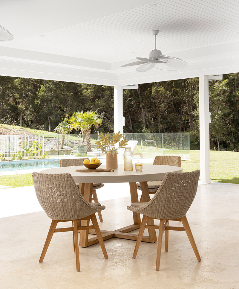 Outdoor dining setting with Beach House Mushroom Viro cord chairs and natural teak furniture