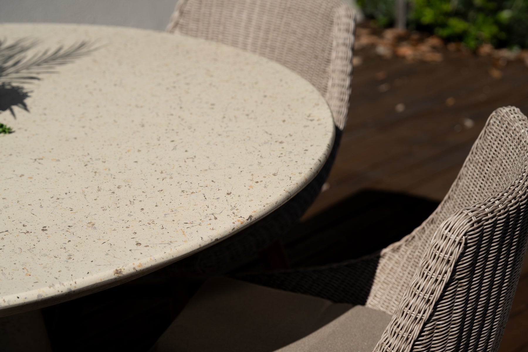Outdoor dining setting with Beach House Mushroom Viro cord chairs and natural teak furniture-close up