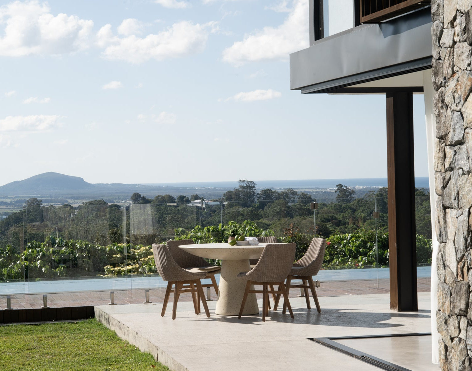 Beach House Outdoor Dining Chairs in Mushroom styled in a relaxed coastal outdoor dining area