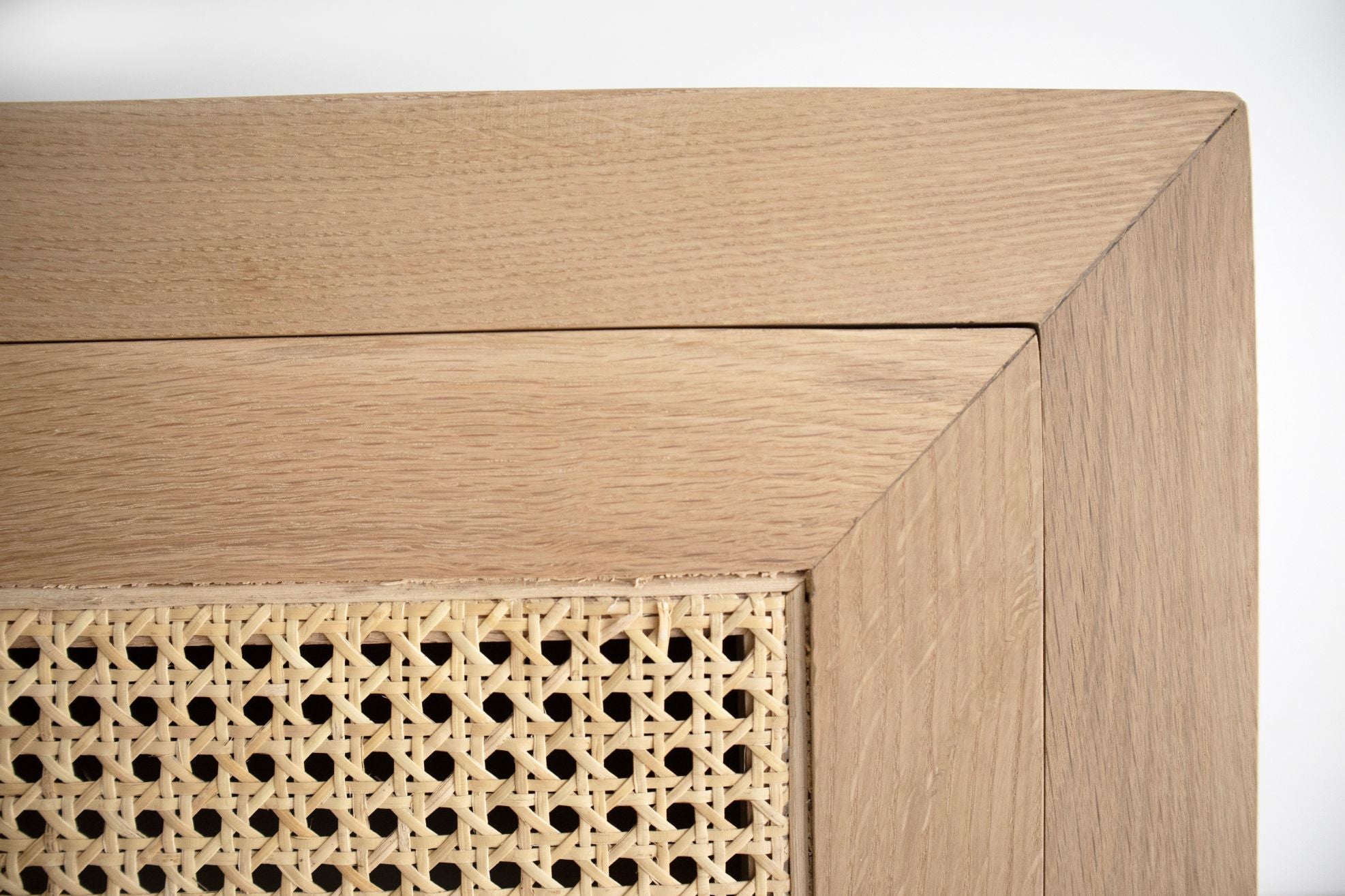 Beach 3 door entertainment unit in solid American oak with rattan doors - up close