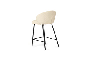 Bellevue Counter Stool with padded natural fabric seat and back, slim black powder-coated steel frame, modern elegant design. Back angle perspective.
