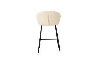 Bellevue Counter Stool with padded natural fabric seat and back, slim black powder-coated steel frame, modern elegant design. Back perspective.