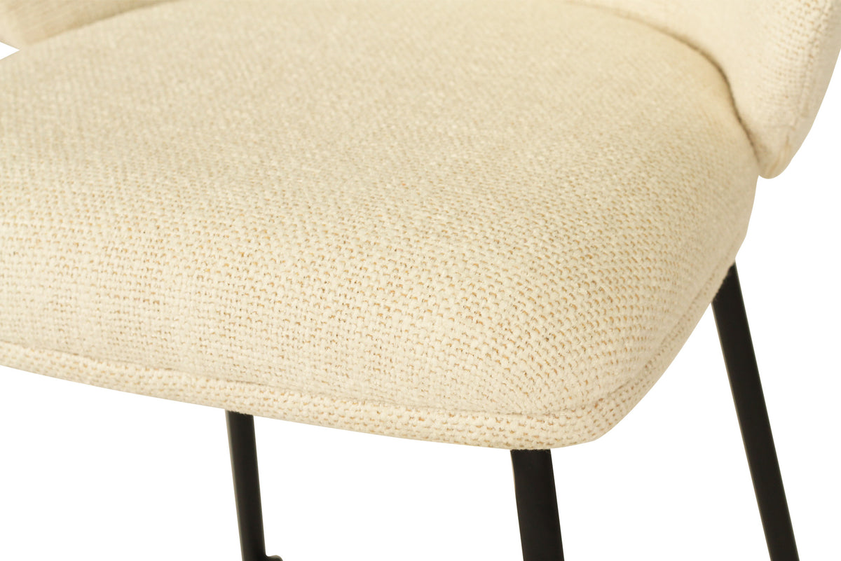 Close-up of the Bellevue counter stool’s padded natural upholstered seat