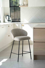Load image into Gallery viewer, Bellevue Counter Stool with padded Pebble fabric seat and back, slim black powder-coated steel frame, modern elegant design. Styled beautifully in this modern kitchen.