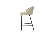 Load image into Gallery viewer, Bellevue Counter Stool with padded Pebble fabric seat and back, slim black powder-coated steel frame, modern elegant design. Side perspective.