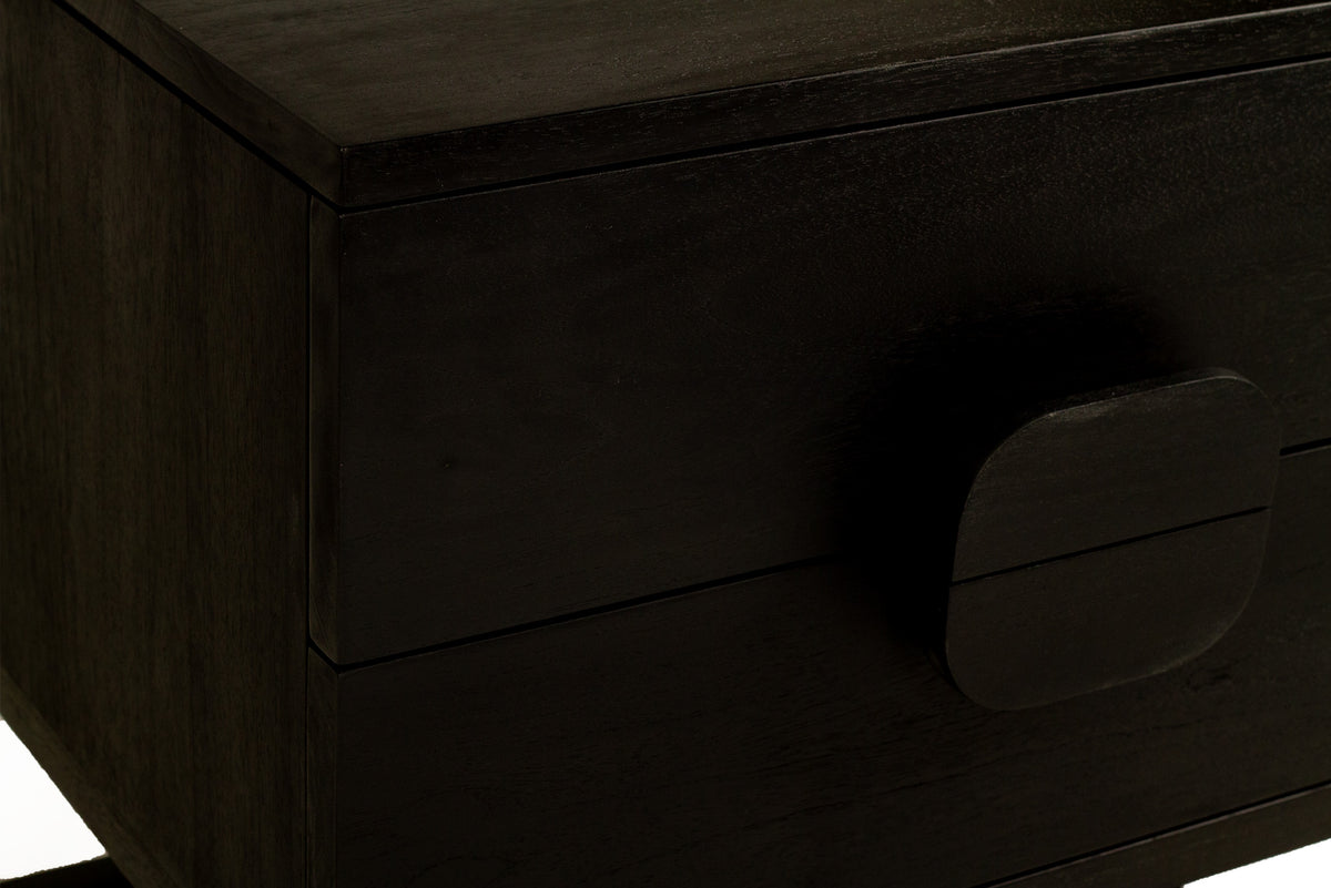 Close-up of the Benji black teak bedside table’s semicircular drawer pulls forming a circular handle