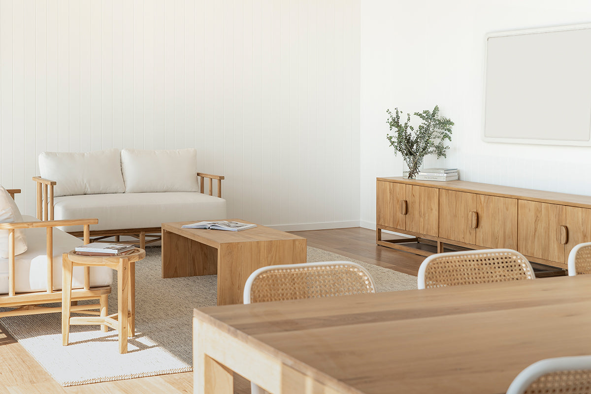 Benji natural teak entertainment unit in a coastal open-plan living and dining room with timber furniture and woven chairs