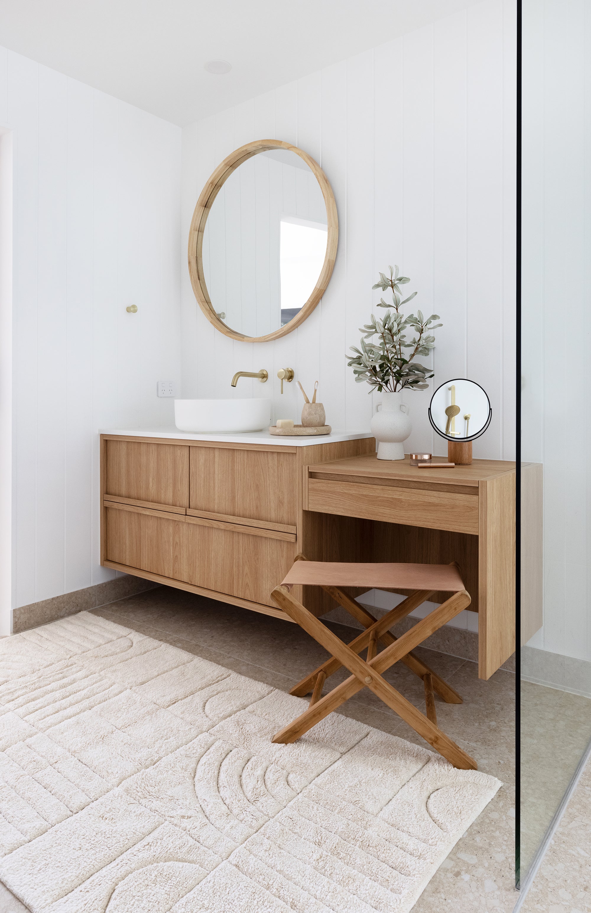Natural cotton bath runner in modern bathroom styled with timber vanity and adjoining makeup desk with soft neutral tones