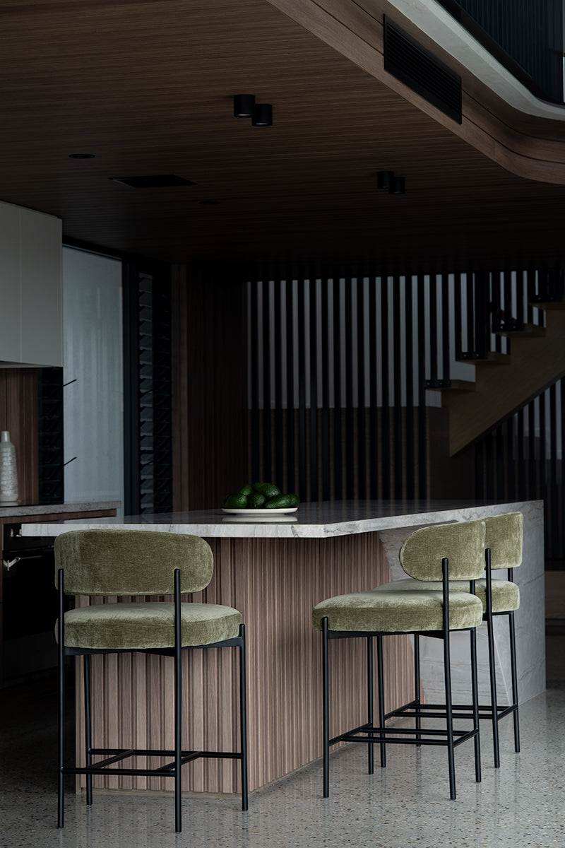 Fontaine Counter Stool with half-moon curved back and metal legs, upholstered in performance velvet in ivy, modern Art Deco inspired counter stool for elegant interiors. Modern elegant kitchen.