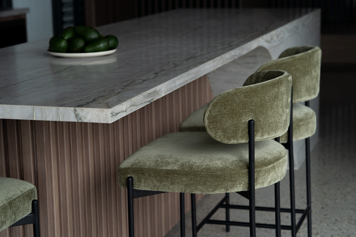 Fontaine Counter Stool with half-moon curved back and metal legs, upholstered in performance velvet in ivy, modern Art Deco inspired counter stool for elegant interiors.  Modern kitchen style.