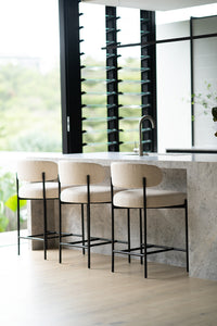 Fontaine Counter Stool with half-moon curved back and metal legs, upholstered in performance linen, modern Art Deco inspired counter stool for elegant interiors.  Modern elegance.