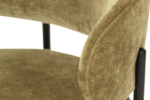 Fontaine Dining Chair with half-moon curved back and metal legs, upholstered in performance ivy velvet, modern Art Deco inspired dining chair for elegant interiors. Close up back rest.