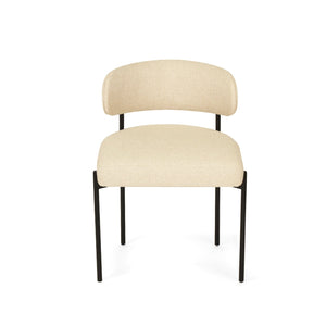 Fontaine Dining Chair with half-moon curved back and metal legs, upholstered in neutral performance linen, modern Art Deco inspired dining chair for elegant interiors.  Front tilt perspective.