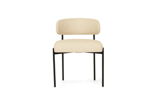 Fontaine Dining Chair with half-moon curved back and metal legs, upholstered in neutral performance linen, modern Art Deco inspired dining chair for elegant interiors.  Front perspective.
