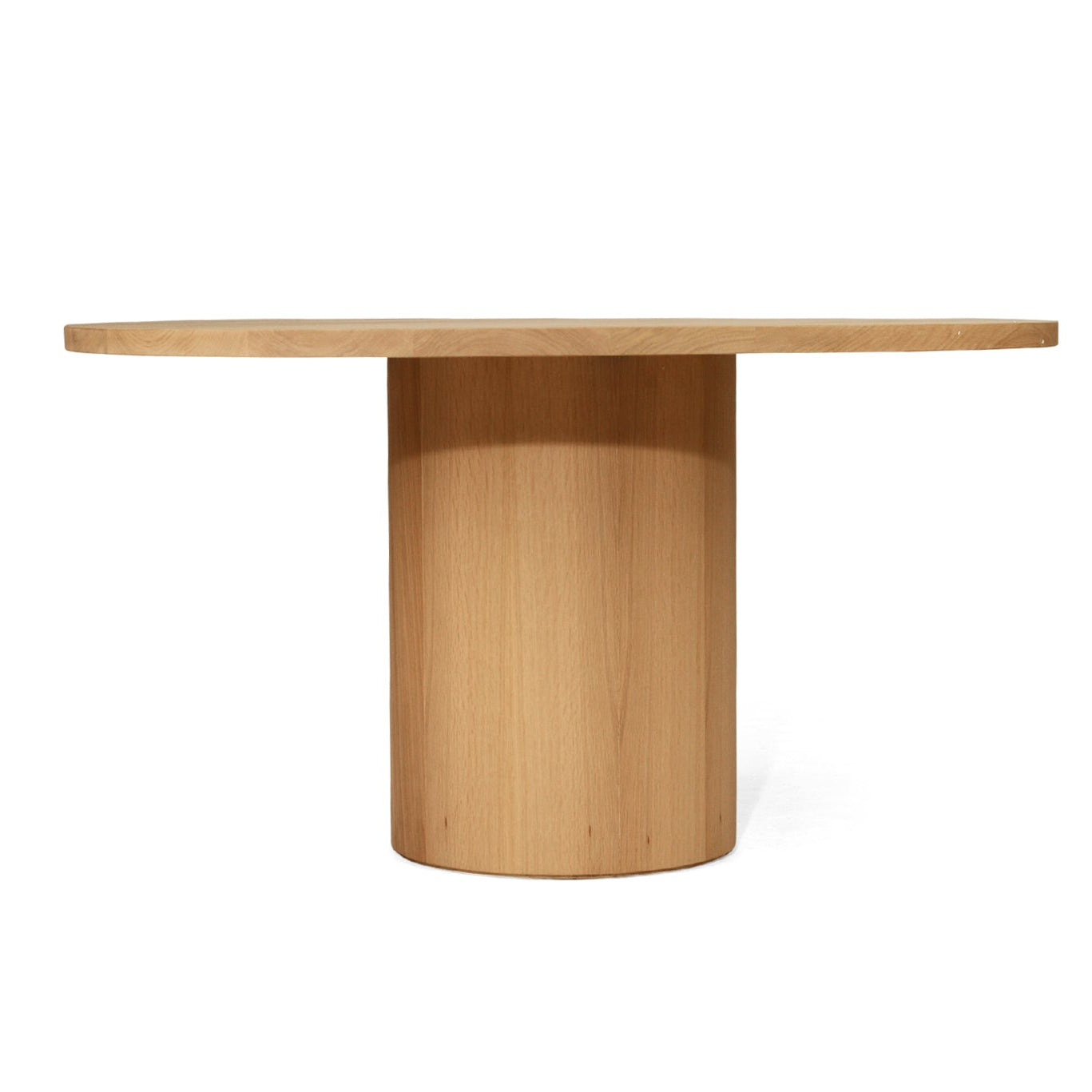 Fontaine Dining Table in solid American Oak with oak veneer base, handcrafted with fine sanded raw finish, modern coastal dining furniture for timeless interiors.  Front view.