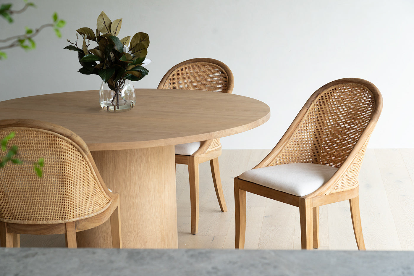 Fontaine Dining Table in solid American Oak with oak veneer base, handcrafted with fine sanded raw finish, modern coastal dining furniture for timeless interiors.  Modern plantation style dining.