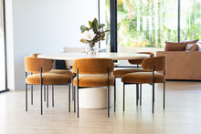 Load image into Gallery viewer, Fontaine Dining Chair with half-moon curved back and metal legs, upholstered in performance amber velvet, modern Art Deco inspired dining chair for elegant interiors. Modern dining room.