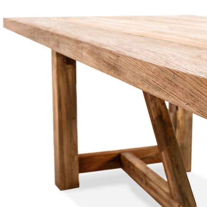 Detail of the solid reclaimed teak legs on the Gather outdoor dining table
