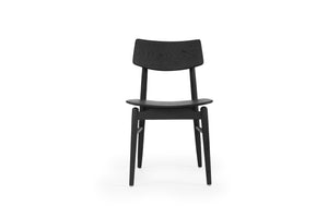 Beautifully crafted dining chair in a solid American Oak Frame with a black finish.  Magnolia Lane modern dining furniture 1