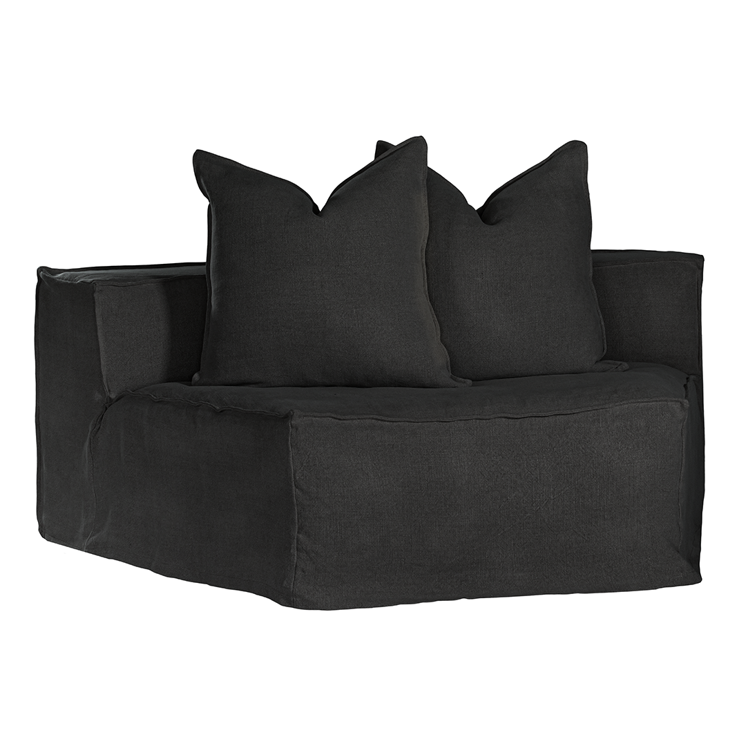 Hendrix Modular Sofa Curve Module in Black, front three-quarter view with two scatter cushions