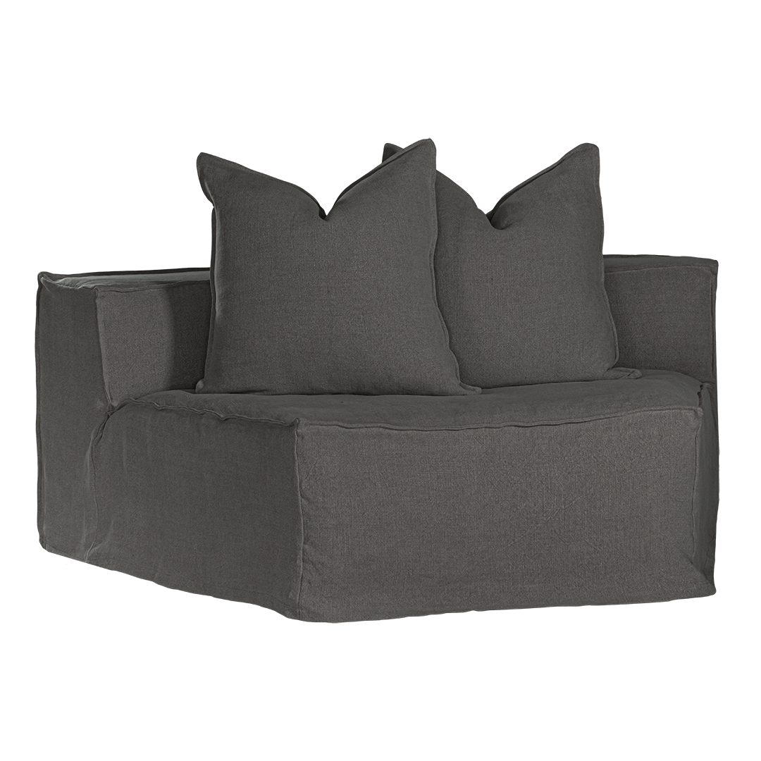 Hendrix Modular Sofa Curve Module in Charcoal, front three-quarter view with two scatter cushions