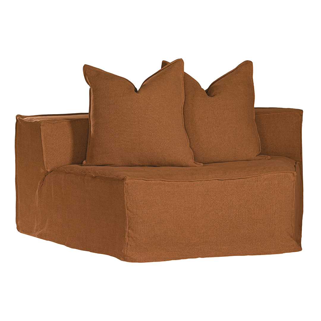 Hendrix Modular Sofa Curve Module in Clay, front three-quarter view with two scatter cushions