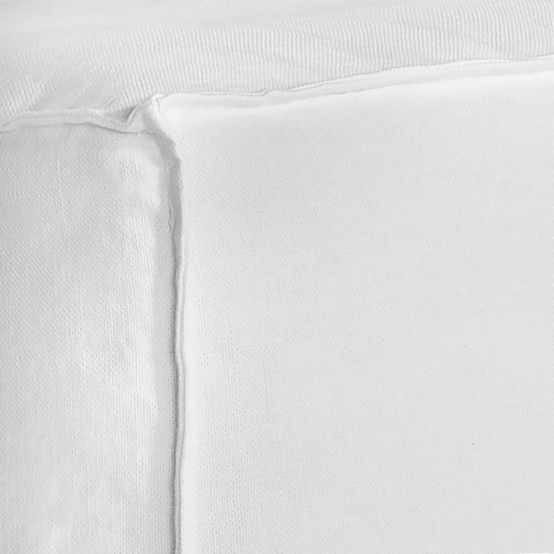 Hendrix Sofa corner section in white, with feather cushioning and removable slipcover, timber frame modern coastal sofa with scatter cushions, available in multiple colours. Corner closeup.