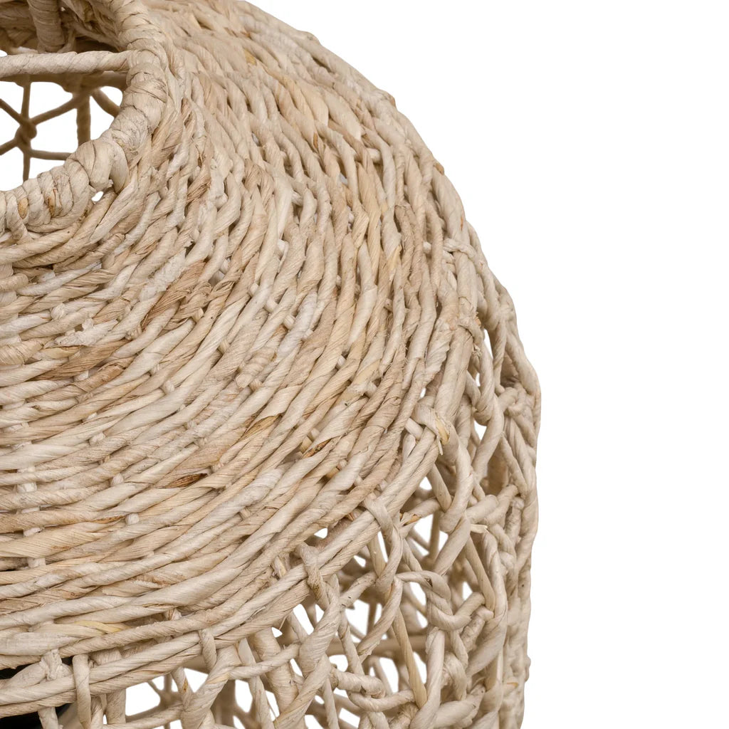 Close-up detail of the Lili Pendant Light by Uniqwa Collections showing handcrafted banana leaf fibre weaving and natural texture.