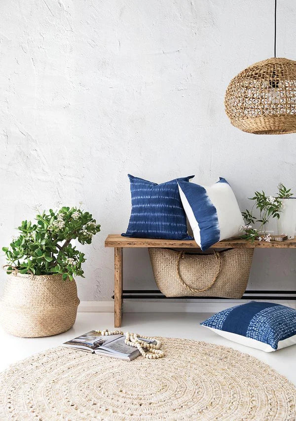 Lili Round Woven Pendant Light by Uniqwa Collections styled in a coastal entry, showcasing natural woven banana fibre texture and organic pendant lighting design.