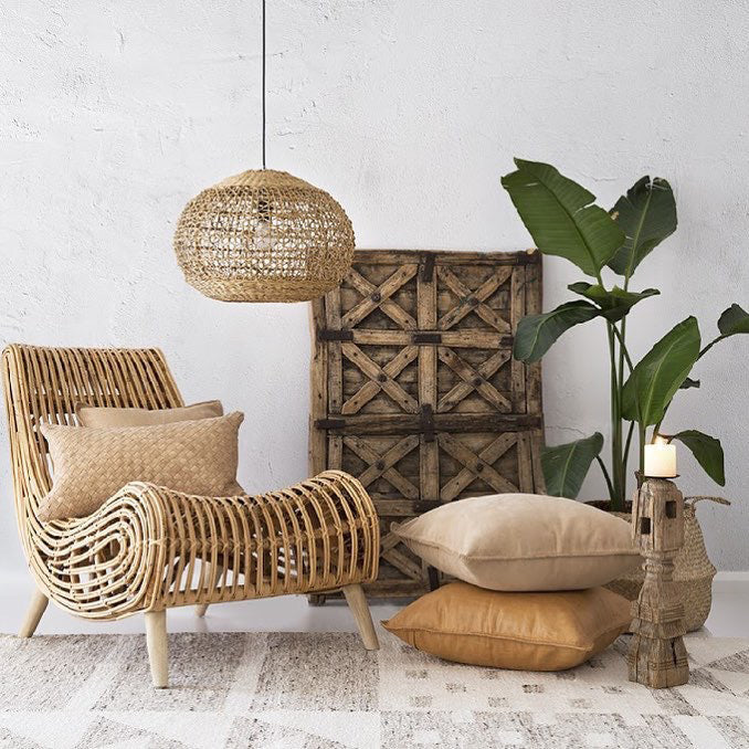 Lili Round Woven Pendant Light by Uniqwa Collections styled in an organic modern bedroom, showcasing natural woven banana fibre texture and organic pendant lighting design.