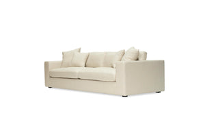 Lucca Four Seater Sofa in performance linen blend upholstery in Dune, refined design, available in boucle oatmeal or saddle leather.  Front angle perspective.
