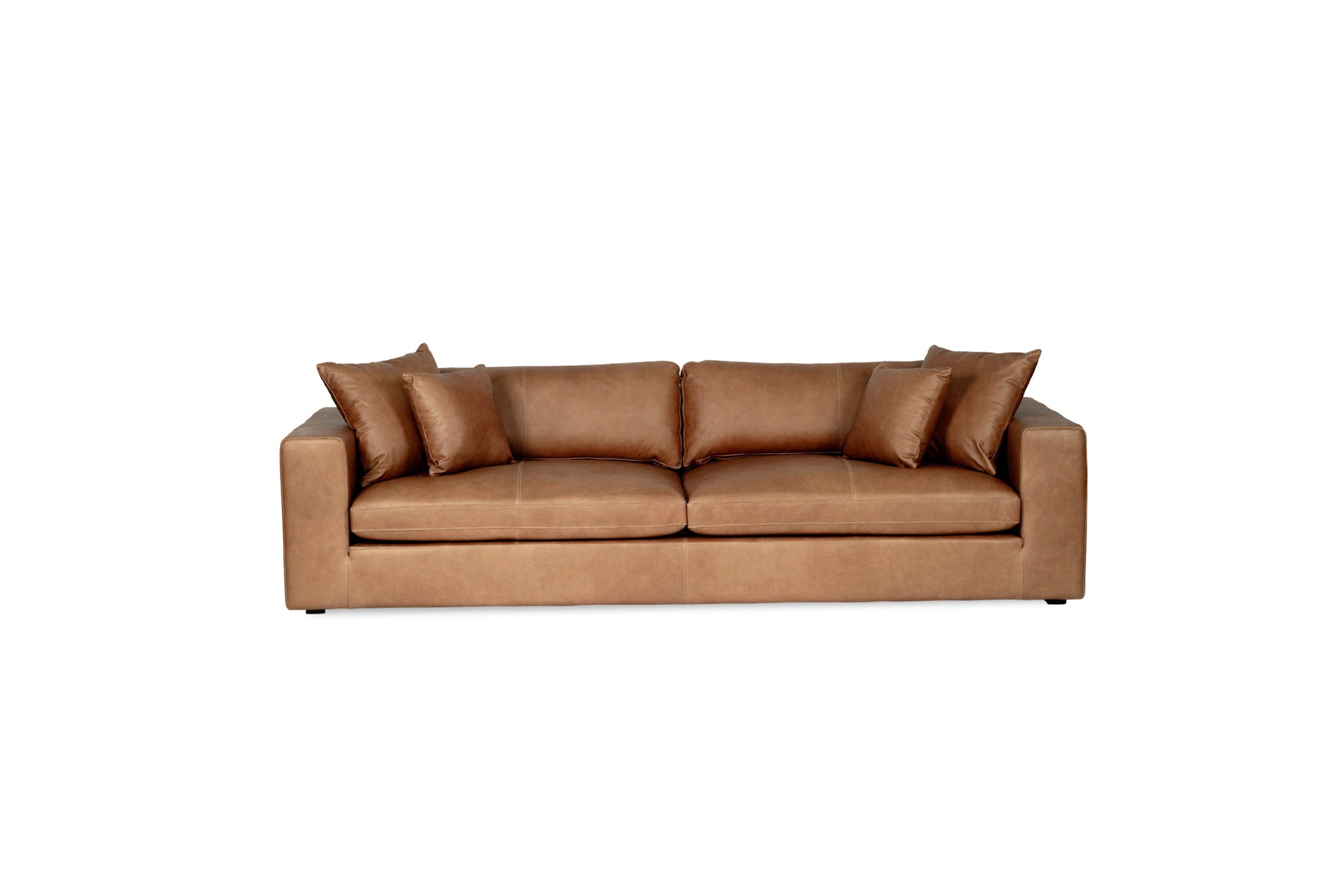 Lucca Four Seater Sofa in trend saddle tan leather with sleek, sophisticated design. Front perspective.