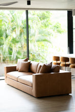 Load image into Gallery viewer, Lucca Four Seater Sofa in trend saddle tan leather with sleek, sophisticated design. Styled in this modern home.