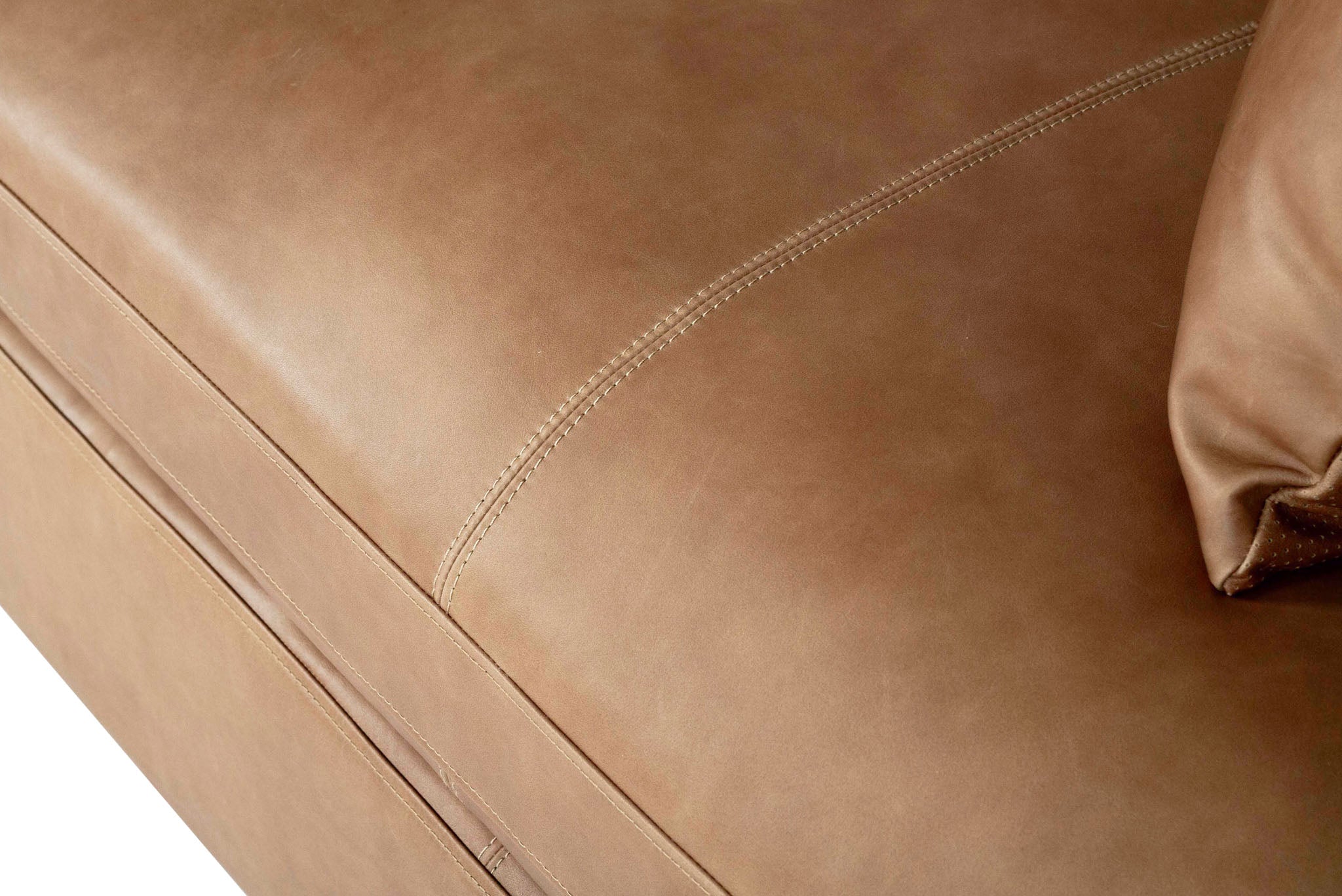Lucca Four Seater Sofa in trend saddle tan leather with sleek, sophisticated design. Seat close up.