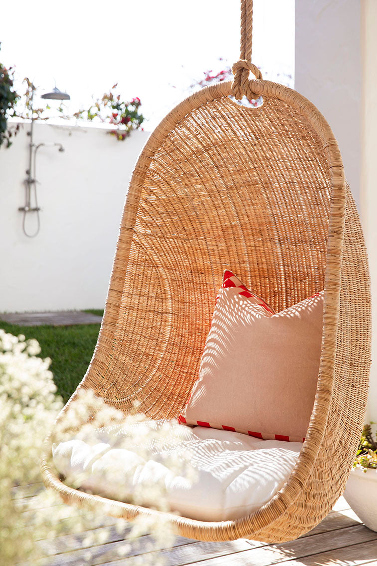 Makenge Rattan Hanging Chair by Uniqwa sold by Magnolia Lane for modern coastal outdoor living 2