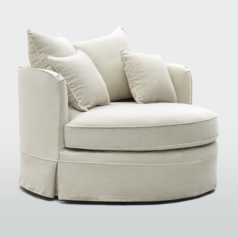 Noosa oversized beige occasional chair showing the deep rounded seat and cushions, front angle