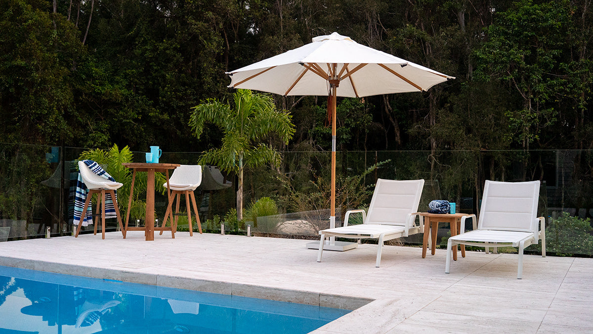 Noosa Outdoor Sun Lounger styled poolside in a coastal outdoor setting