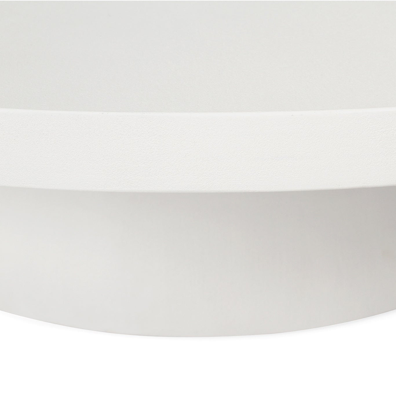 Close-up edge detail of the Oasis Coffee Table showcasing the smooth matte white microcement finish.